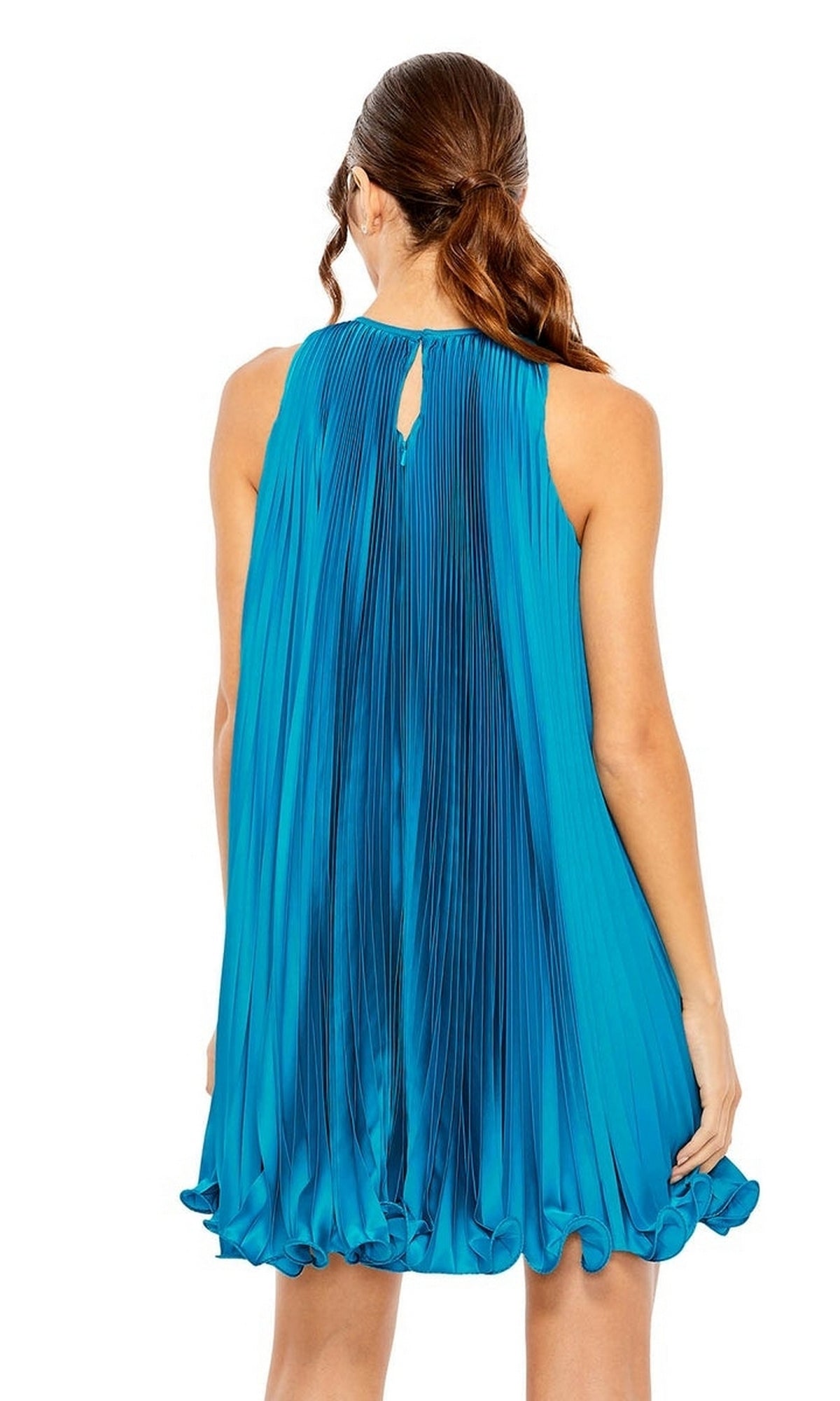A woman with brown hair in a low ponytail is seen from the back wearing the Mac Duggal 49636, a sleeveless, loose-fitting, high-neck short pleated semi-formal dress.